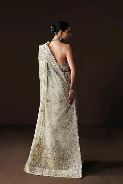 Shop luxury organza embroidered saree with hand embellished blouse, pallu & borders. Includes raw silk inner—perfect for weddings & festive wear.