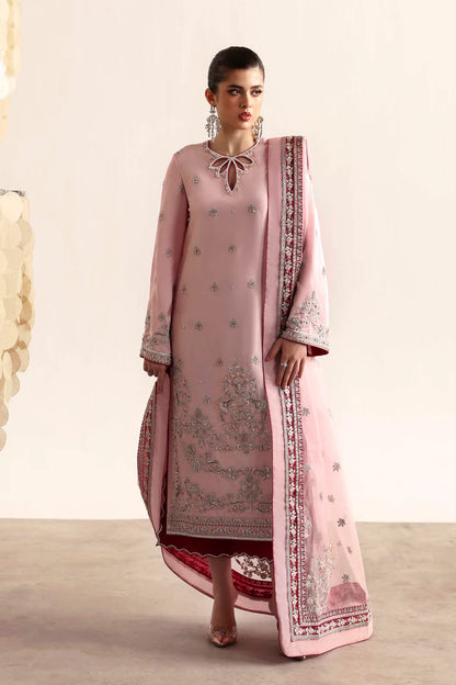 Elegant silk suit featuring hand-embroidered front, back, and sleeves, dyed silk trouser, and a 3-yard organza dupatta with embroidered borders and motifs.
