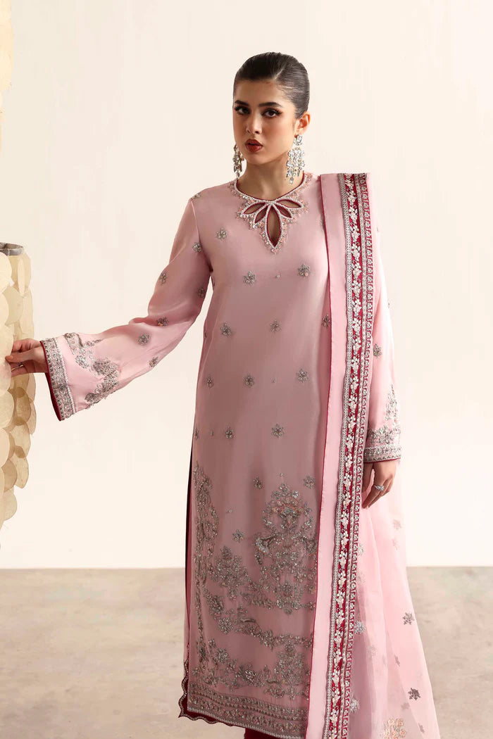 Elegant silk suit featuring hand-embroidered front, back, and sleeves, dyed silk trouser, and a 3-yard organza dupatta with embroidered borders and motifs.