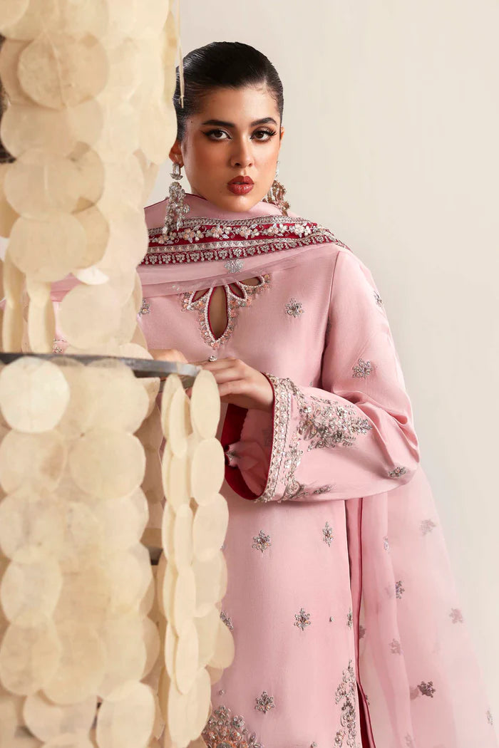 Elegant silk suit featuring hand-embroidered front, back, and sleeves, dyed silk trouser, and a 3-yard organza dupatta with embroidered borders and motifs.