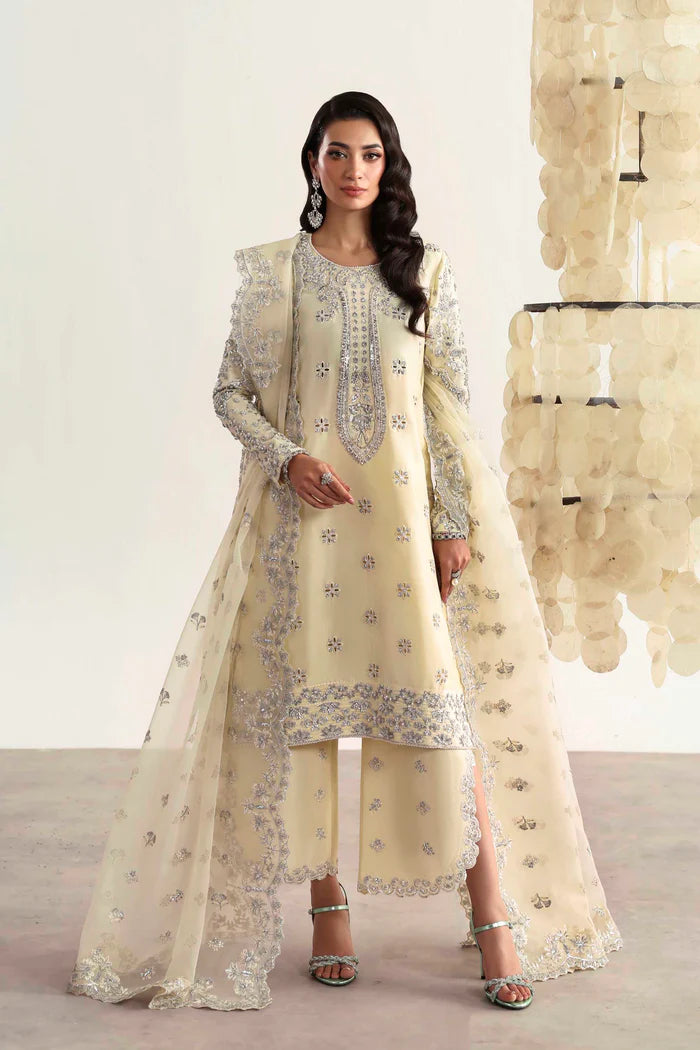 Luxury silk suit featuring hand-embroidered front, back, and sleeves, matching embroidered trouser, organza dupatta, and delicate organza motifs for a complete ensemble.