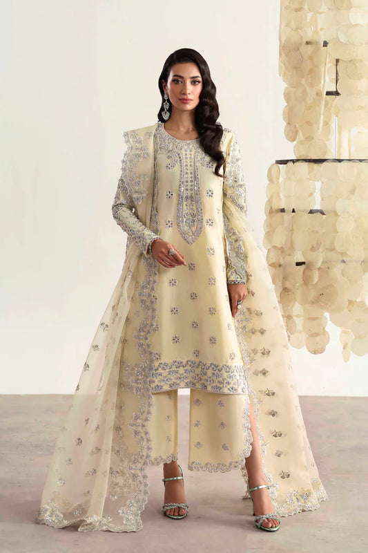 Luxury silk suit featuring hand-embroidered front, back, and sleeves, matching embroidered trouser, organza dupatta, and delicate organza motifs for a complete ensemble.