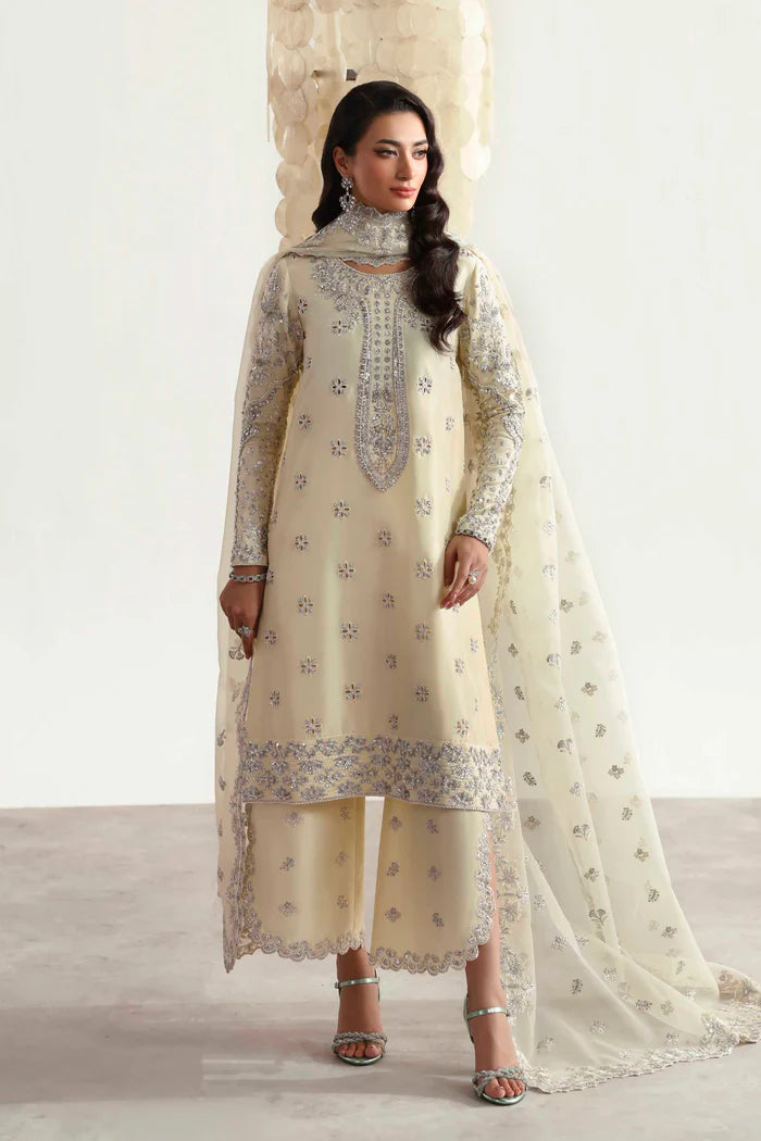 Luxury silk suit featuring hand-embroidered front, back, and sleeves, matching embroidered trouser, organza dupatta, and delicate organza motifs for a complete ensemble.