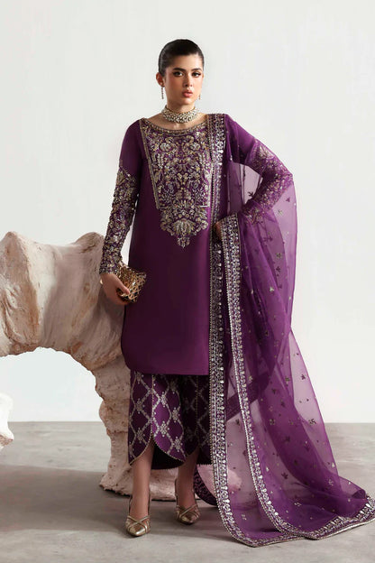 Elegant silk suit featuring hand-embellished embroidered front, dyed silk back, detailed sleeves, matching embroidered trouser, and an organza dupatta.
