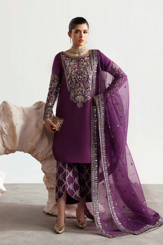 Elegant silk suit featuring hand-embellished embroidered front, dyed silk back, detailed sleeves, matching embroidered trouser, and an organza dupatta.