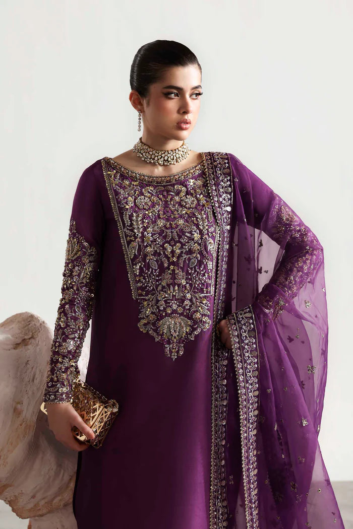 Elegant silk suit featuring hand-embellished embroidered front, dyed silk back, detailed sleeves, matching embroidered trouser, and an organza dupatta.