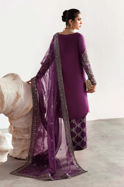 Elegant silk suit featuring hand-embellished embroidered front, dyed silk back, detailed sleeves, matching embroidered trouser, and an organza dupatta.