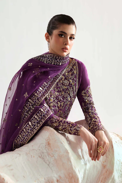Elegant silk suit featuring hand-embellished embroidered front, dyed silk back, detailed sleeves, matching embroidered trouser, and an organza dupatta.