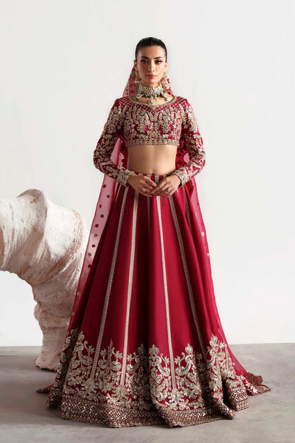 Elegant silk ensemble featuring hand-embellished front and body panels, embroidered sleeves, detailed organza neckline, and a matching embroidered dupatta.
