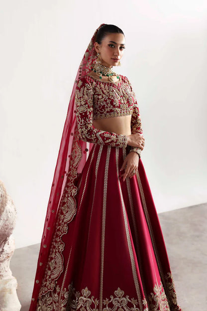Elegant silk ensemble featuring hand-embellished front and body panels, embroidered sleeves, detailed organza neckline, and a matching embroidered dupatta.