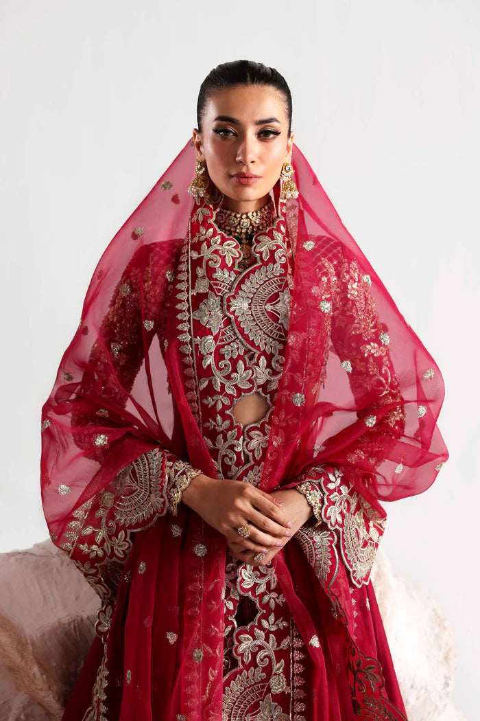 Elegant silk ensemble featuring hand-embellished front and body panels, embroidered sleeves, detailed organza neckline, and a matching embroidered dupatta.