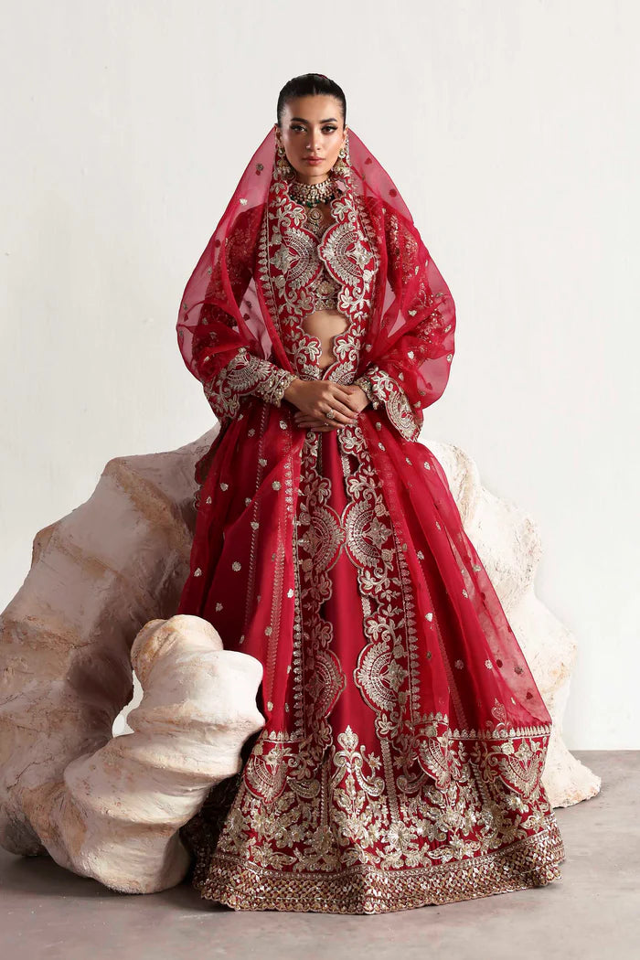 Elegant silk ensemble featuring hand-embellished front and body panels, embroidered sleeves, detailed organza neckline, and a matching embroidered dupatta.