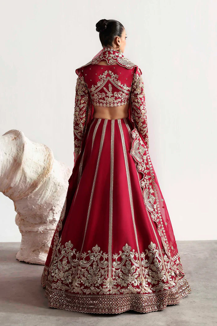 Elegant silk ensemble featuring hand-embellished front and body panels, embroidered sleeves, detailed organza neckline, and a matching embroidered dupatta.