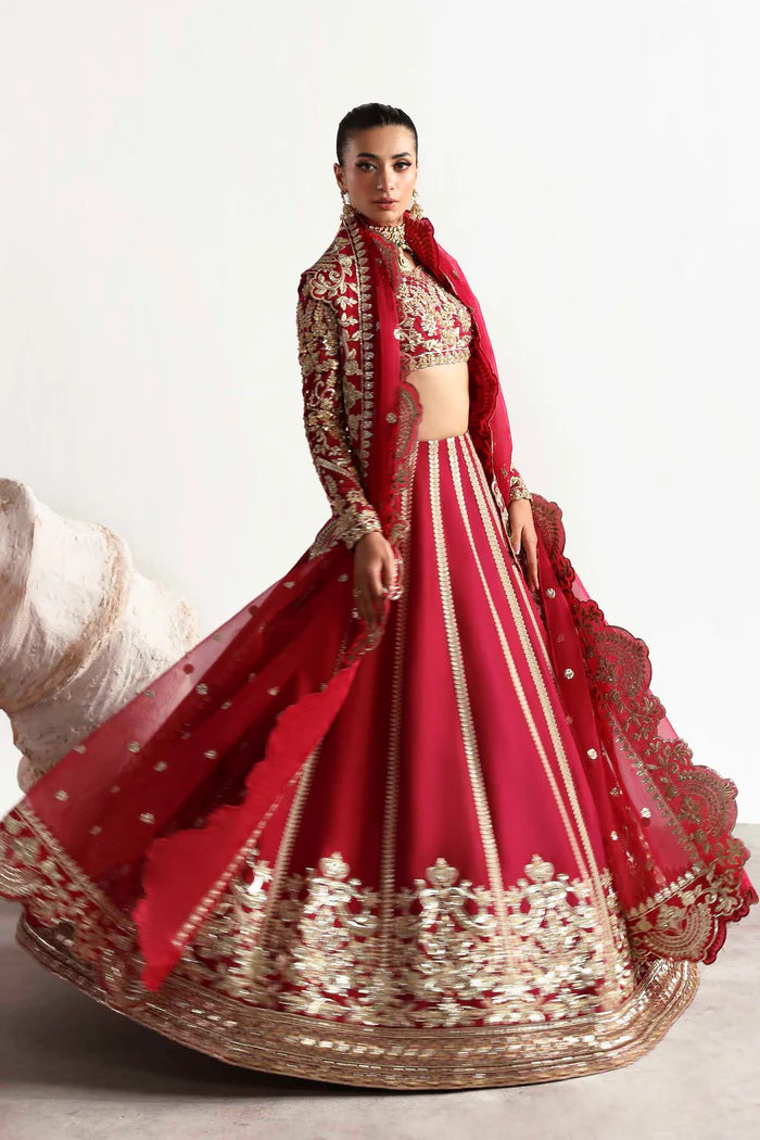 Elegant silk ensemble featuring hand-embellished front and body panels, embroidered sleeves, detailed organza neckline, and a matching embroidered dupatta.