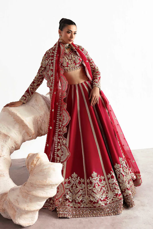 Elegant silk ensemble featuring hand-embellished front and body panels, embroidered sleeves, detailed organza neckline, and a matching embroidered dupatta.