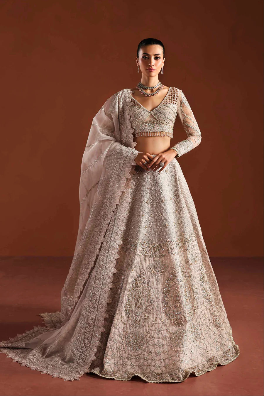 Shop organza embroidered dress with hand embellished blouse, panels & dupatta. Includes lining—perfect for weddings, parties & festive wear.