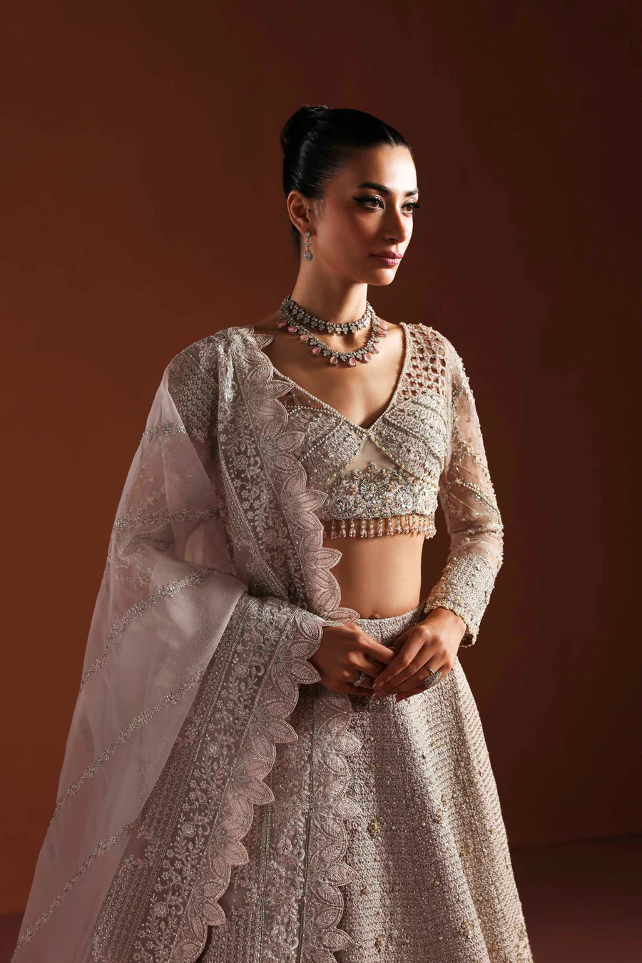 Shop organza embroidered dress with hand embellished blouse, panels & dupatta. Includes lining—perfect for weddings, parties & festive wear.