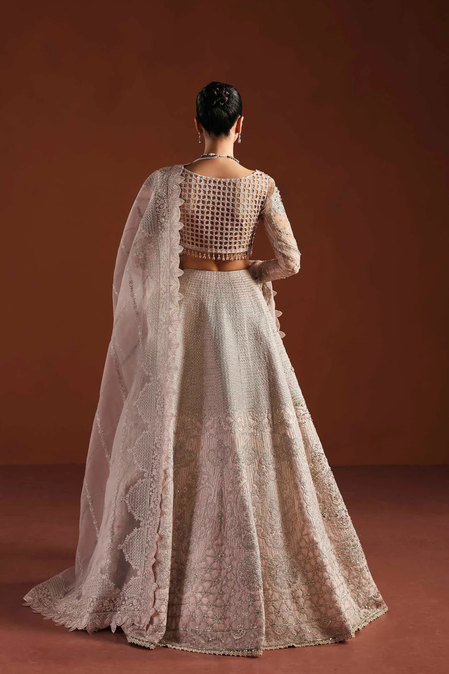 Shop organza embroidered dress with hand embellished blouse, panels & dupatta. Includes lining—perfect for weddings, parties & festive wear.