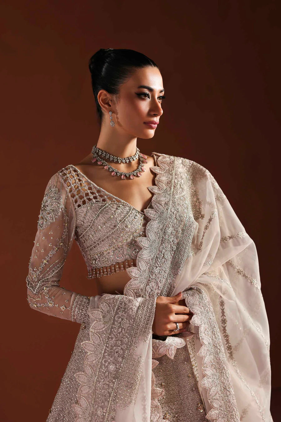 Shop organza embroidered dress with hand embellished blouse, panels & dupatta. Includes lining—perfect for weddings, parties & festive wear.