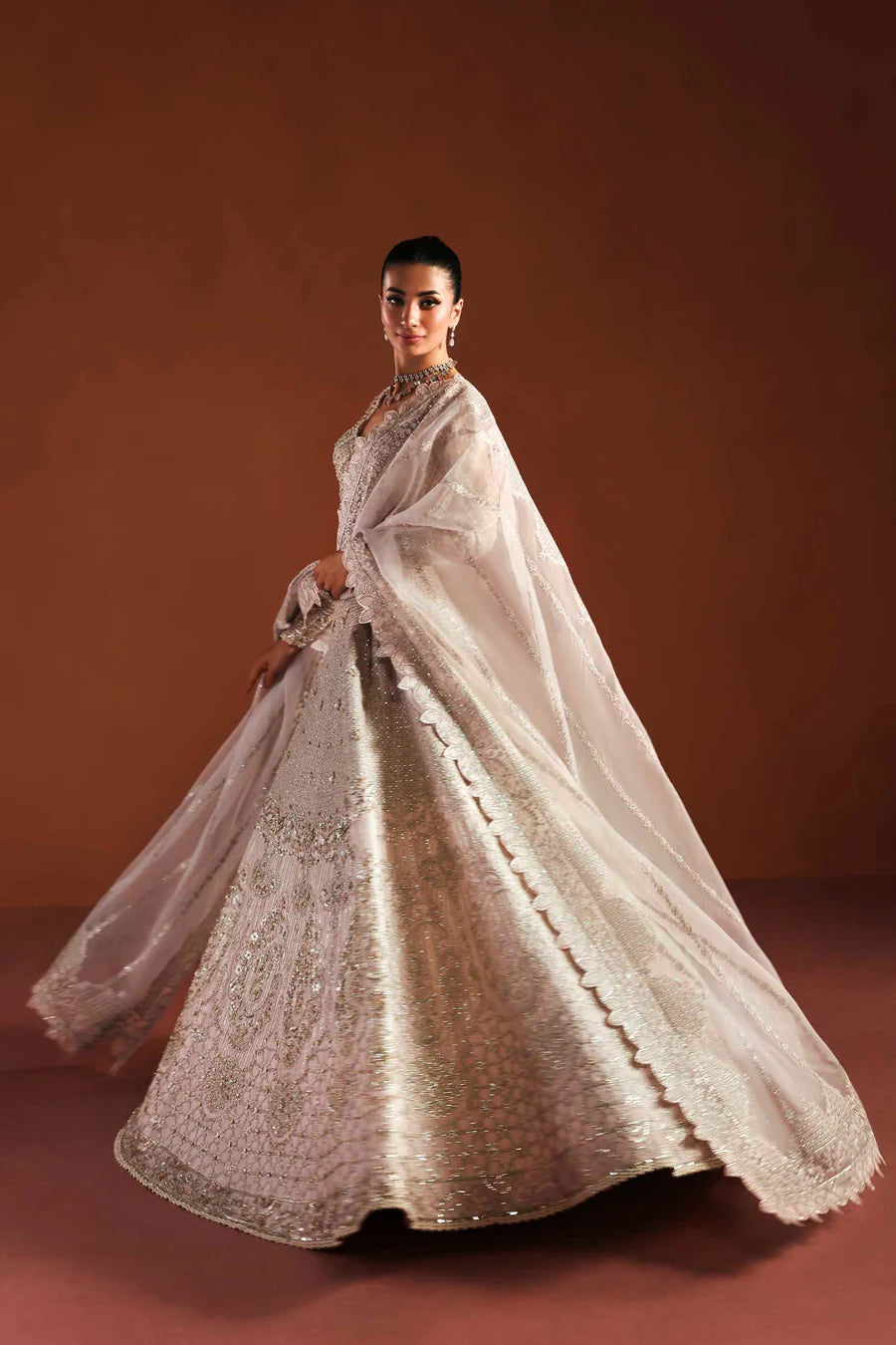 Shop organza embroidered dress with hand embellished blouse, panels & dupatta. Includes lining—perfect for weddings, parties & festive wear.