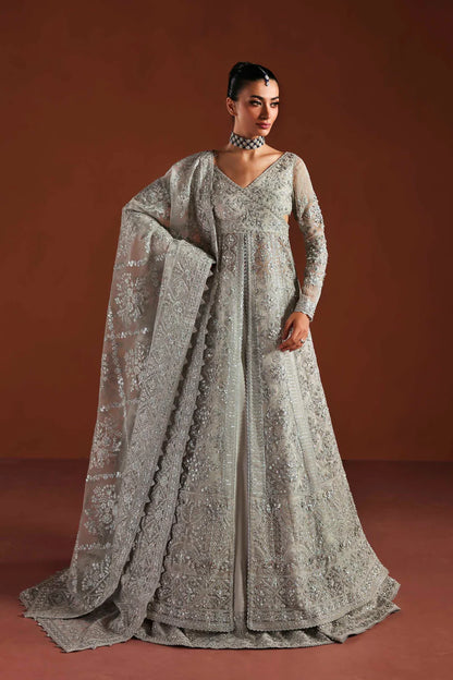 Shop luxury organza embroidered lehenga with hand embellished blouse, panels & dupatta. Includes raw silk lehenga & lining—perfect for weddings.