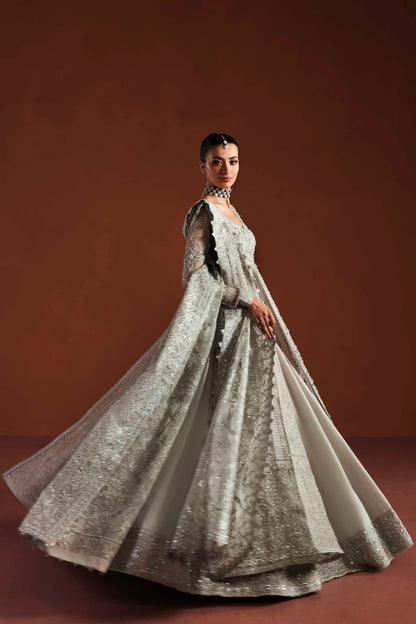 Shop luxury organza embroidered lehenga with hand embellished blouse, panels & dupatta. Includes raw silk lehenga & lining—perfect for weddings.