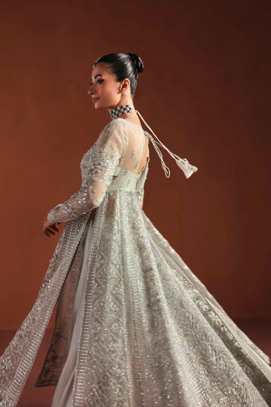Shop luxury organza embroidered lehenga with hand embellished blouse, panels & dupatta. Includes raw silk lehenga & lining—perfect for weddings.