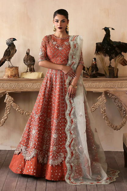 Elegant hand-embroidered organza suit with detailed front, back, and sleeves panels, complemented by an embroidered organza dupatta—perfect for festive and formal occasions.