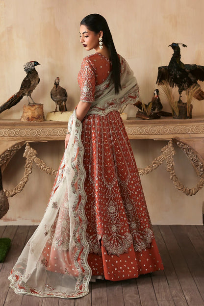 Elegant hand-embroidered organza suit with detailed front, back, and sleeves panels, complemented by an embroidered organza dupatta—perfect for festive and formal occasions.