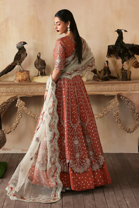 Elegant hand-embroidered organza suit with detailed front, back, and sleeves panels, complemented by an embroidered organza dupatta—perfect for festive and formal occasions.