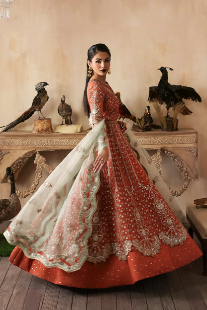 Elegant hand-embroidered organza suit with detailed front, back, and sleeves panels, complemented by an embroidered organza dupatta—perfect for festive and formal occasions.