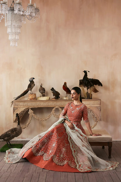Elegant hand-embroidered organza suit with detailed front, back, and sleeves panels, complemented by an embroidered organza dupatta—perfect for festive and formal occasions.