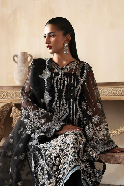 Elegant hand-embroidered organza suit with detailed front, back, and sleeves panels, paired with a matching organza dupatta and dyed trousers—perfect for festive occasions.