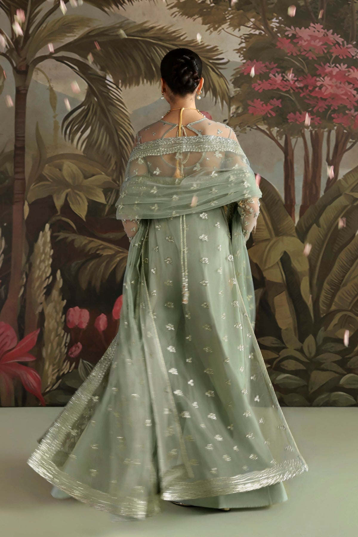 Akbar Aslam Zohal back view with net back border