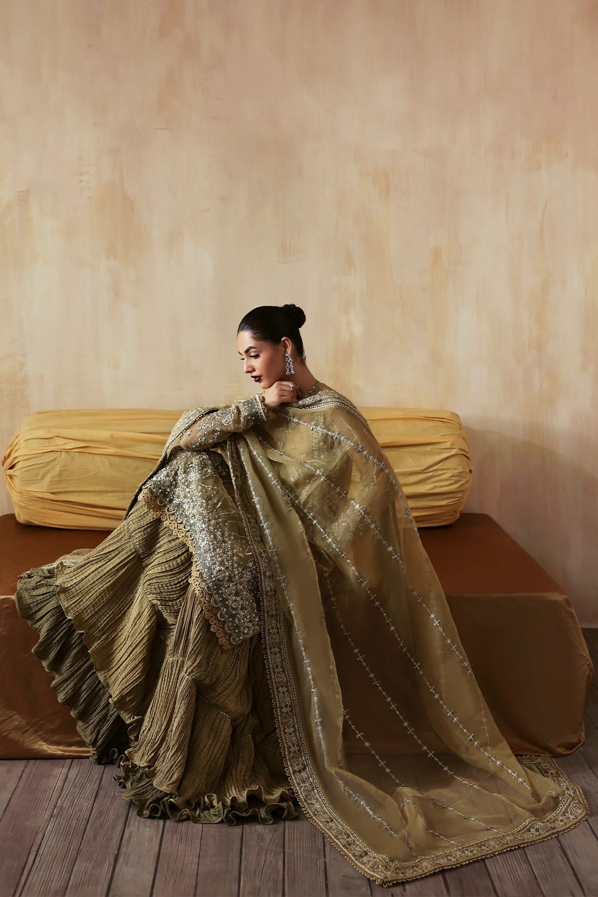 Exquisite hand-embroidered organza suit featuring detailed front, back, and sleeves panels, paired with an embroidered organza dupatta and dyed trousers for festive elegance.