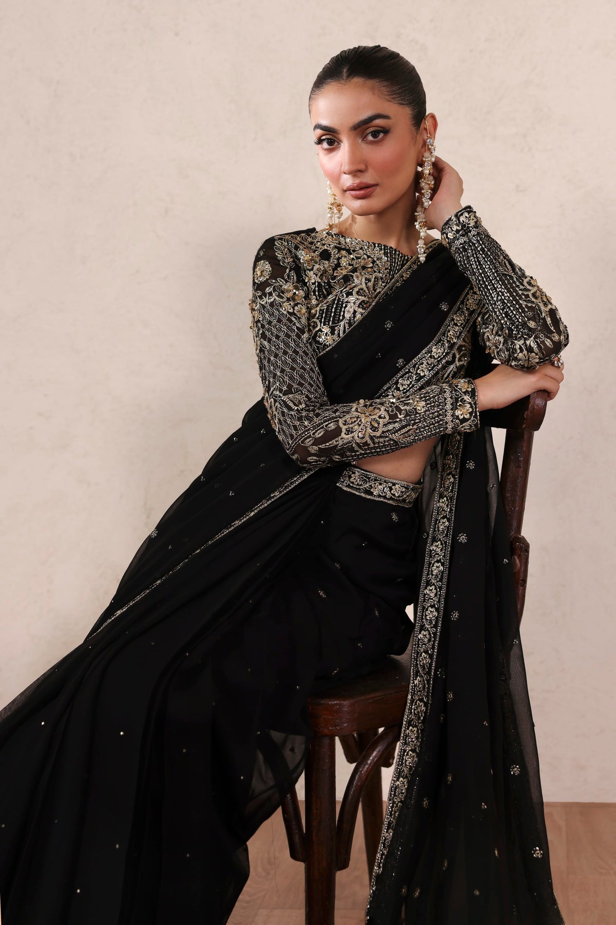 Akbar Aslam Amoura back view of chiffon blouse and saree