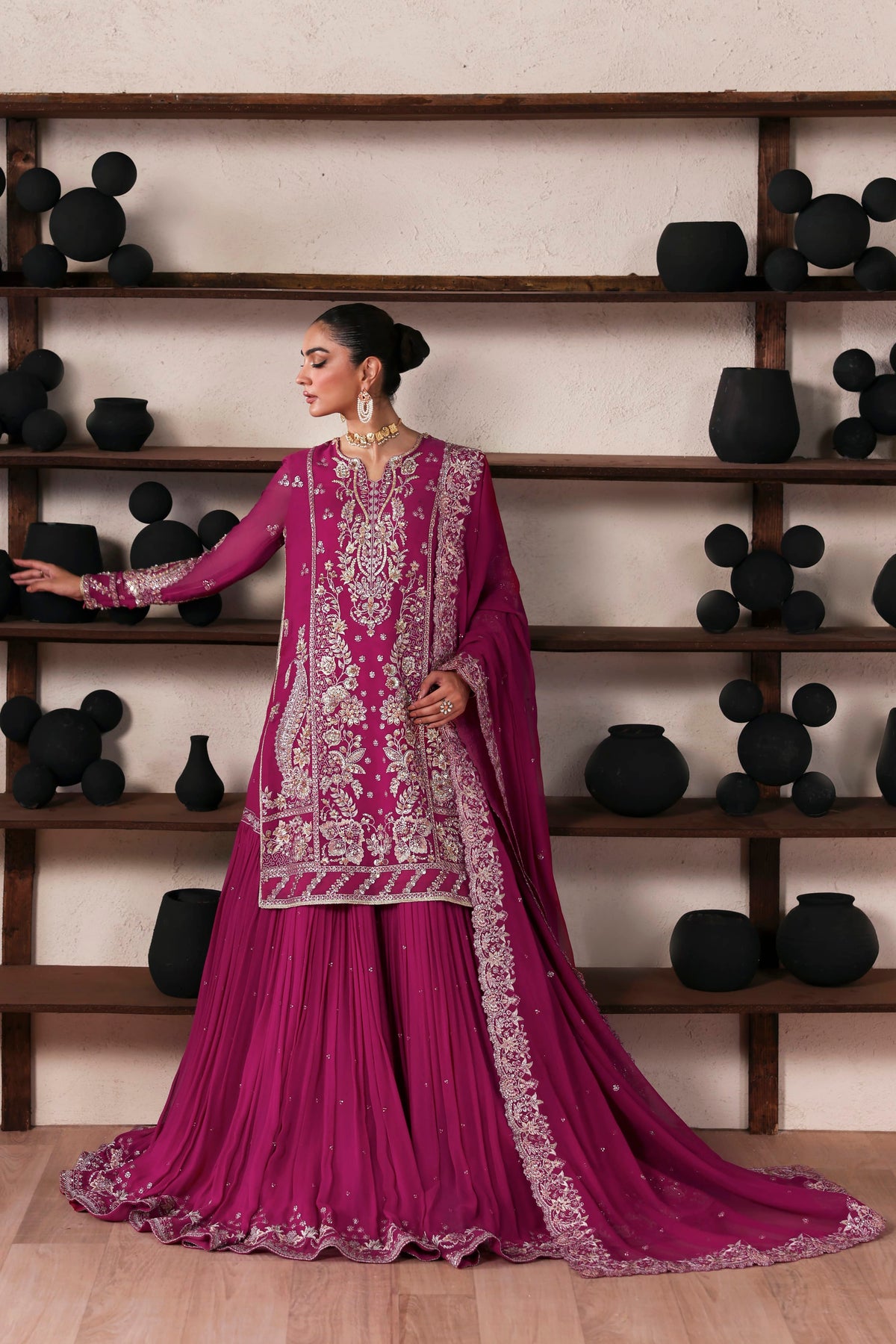 Akbar Aslam Rosalie side view of kameez and gharara