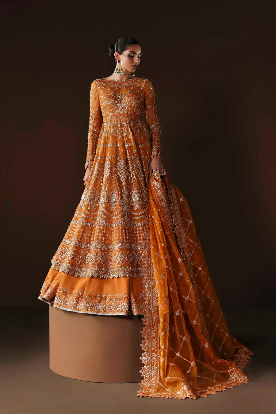 Shop organza embroidered lehenga with hand embellished blouse, panels & dupatta. Includes raw silk lining—perfect for weddings & festive wear.
