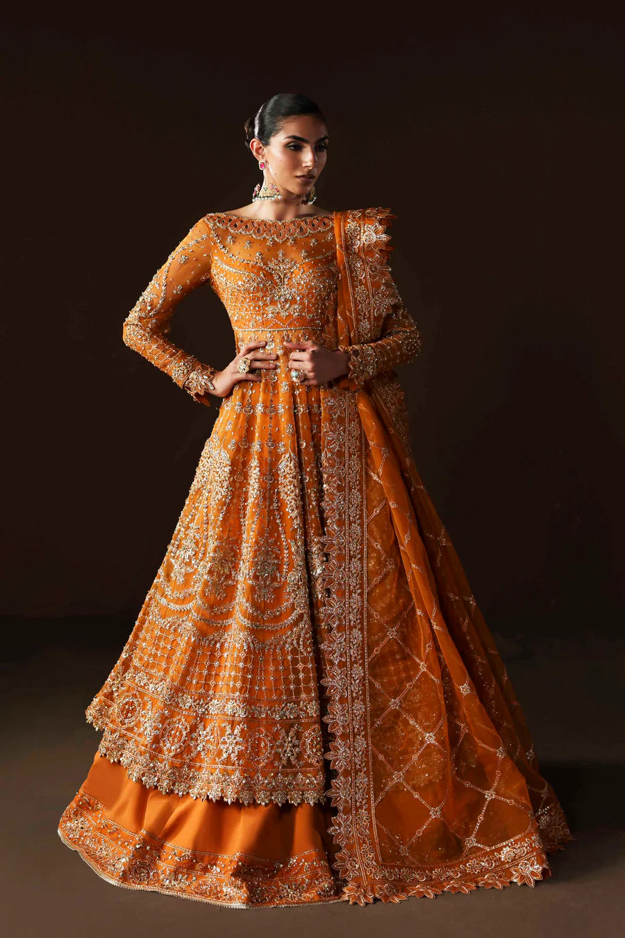 Shop organza embroidered lehenga with hand embellished blouse, panels & dupatta. Includes raw silk lining—perfect for weddings & festive wear.