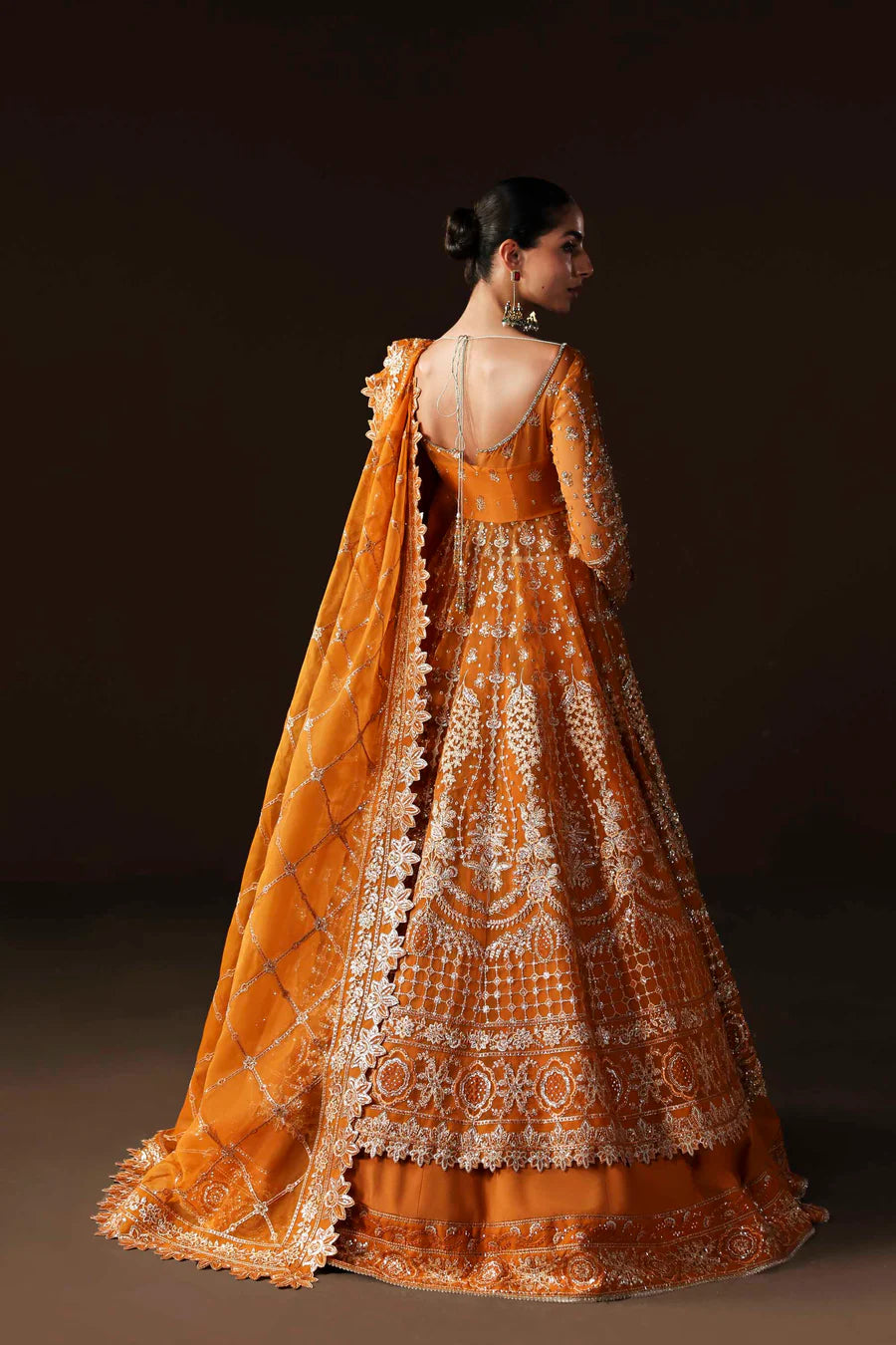 Shop organza embroidered lehenga with hand embellished blouse, panels & dupatta. Includes raw silk lining—perfect for weddings & festive wear.