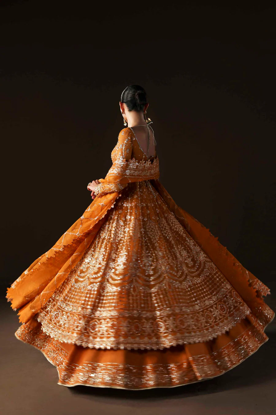 Shop organza embroidered lehenga with hand embellished blouse, panels & dupatta. Includes raw silk lining—perfect for weddings & festive wear.