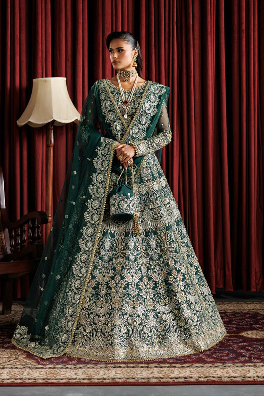 Beautiful net embroidered lehenga with hand embellished panels & sleeves. Includes net dupatta, organza belt, and 6 yards Russian grip inner fabric.