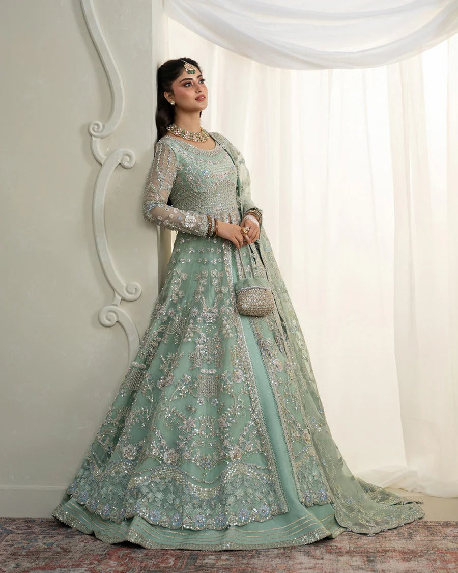 Selin lehenga set in mint green organza with heritage embroidery, paired with raw silk skirt and embroidered dupatta—perfect for weddings and festive celebrations.