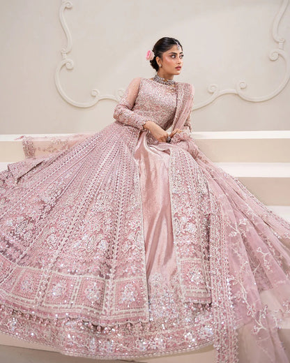 Exquisite Leyan lehenga set in dusty pink net with intricate embroidery on blouse, lehenga, and dupatta. Perfect for weddings, festive occasions, and formal events.