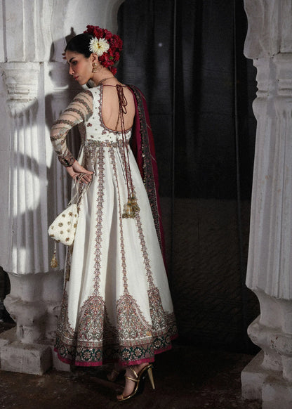 Elegant ivory embroidered pishwas with detailed panels, net sleeves, printed Korean raw silk chooridar and an embroidered Korean silk shawl for formal events.