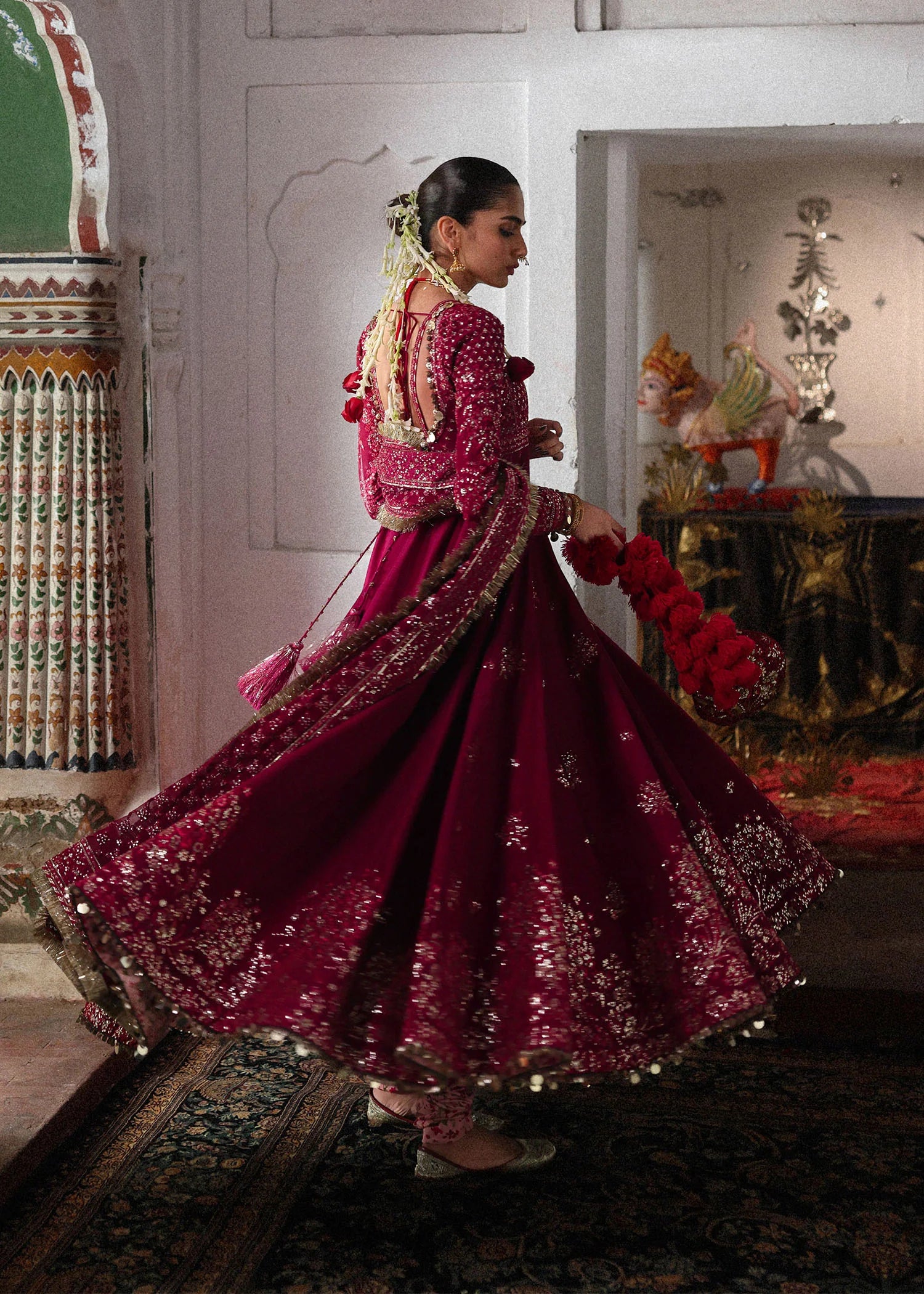 Elegant hot pink embroidered pishwas with detailed panels, Korean raw silk chooridar and a chiffon dupatta featuring all-over jaal and four sided borders.