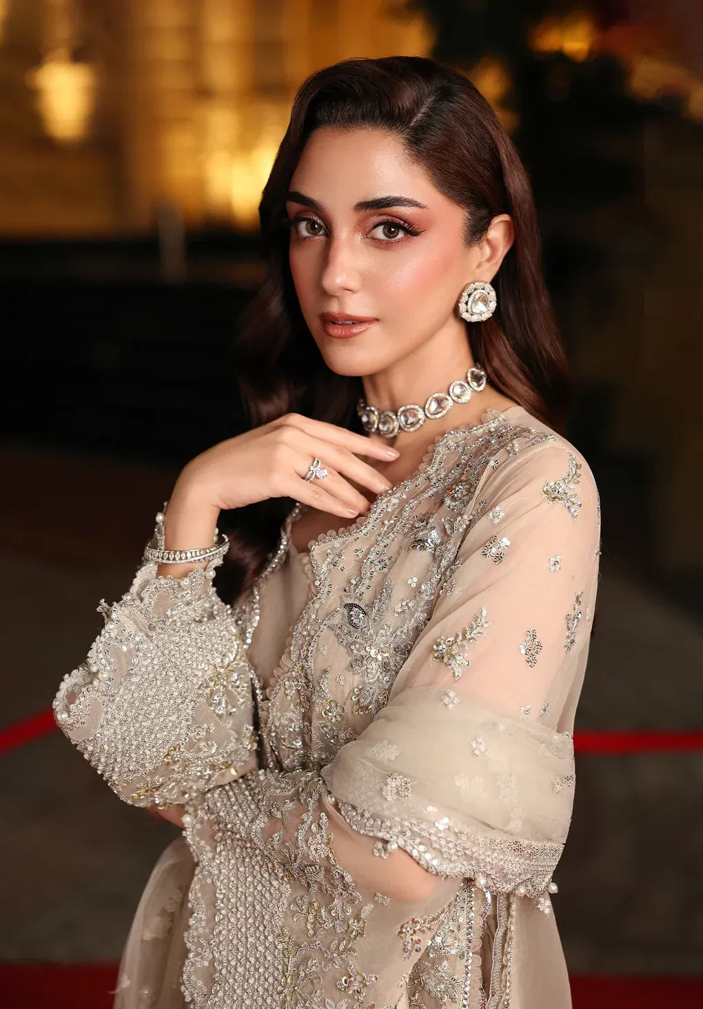 Stardust by Elaf Stardom ’25 features hand-embroidered organza panels, embroidered poly-net dupatta, and raw silk inner — ideal for festive and formal elegance.