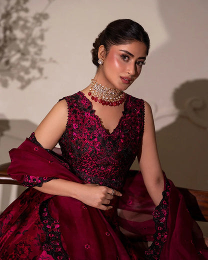 Havin set in dark magenta shamose silk with printed and embroidered shirt, paired with embroidered organza/net dupatta and silk trousers—perfect for festive occasions.