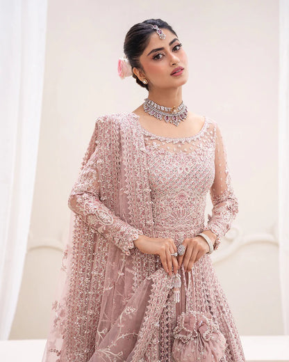 Exquisite Leyan lehenga set in dusty pink net with intricate embroidery on blouse, lehenga, and dupatta. Perfect for weddings, festive occasions, and formal events.