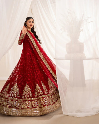 Gul festive set in vibrant scarlet chiffon with intricate embroidery, paired with silk churidar and organza dupatta—perfect for weddings and celebratory occasions.